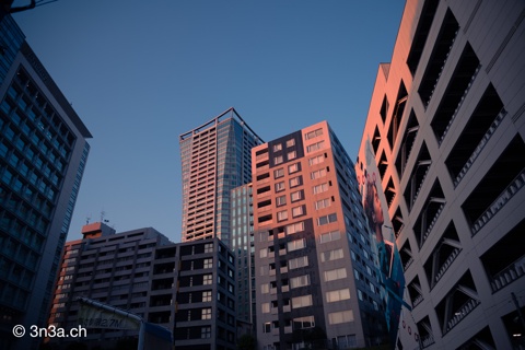 Sun setting over skyscrapers